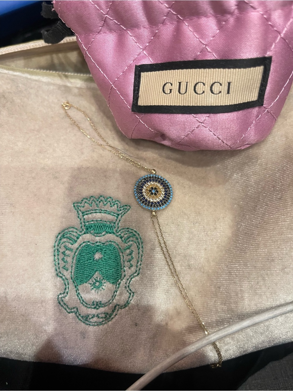 Gucci Gold Bracelet with Blue and Black Pavé Evil Eye Charm
